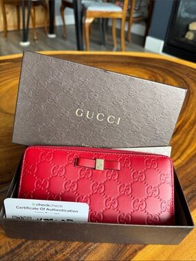 Gucci embossed wallet with ribbon